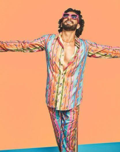 Ranveer Singh is known to flaunt vibrant colors through his outfits boldly, and this ice-cream-printed shirt featuring multiple hues is no exception. Paired with matching pants, the ensemble is a lively, eye-catching choice that perfectly embodies the fun and energetic spirit of a summer Holi celebration.