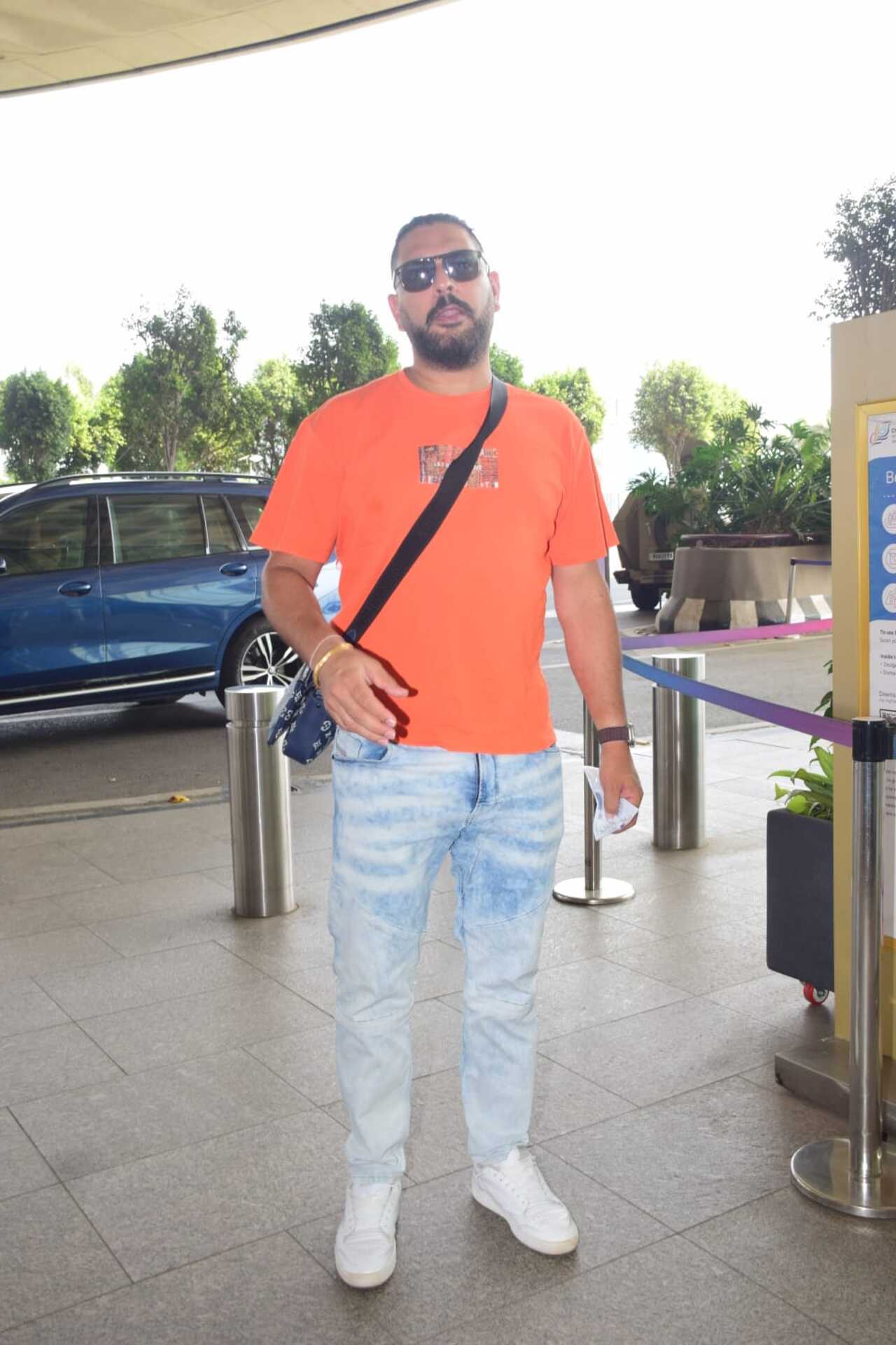Former cricketer Yuvraj Singh was spotted in a bright orange t-shirt at Mumbai airport
