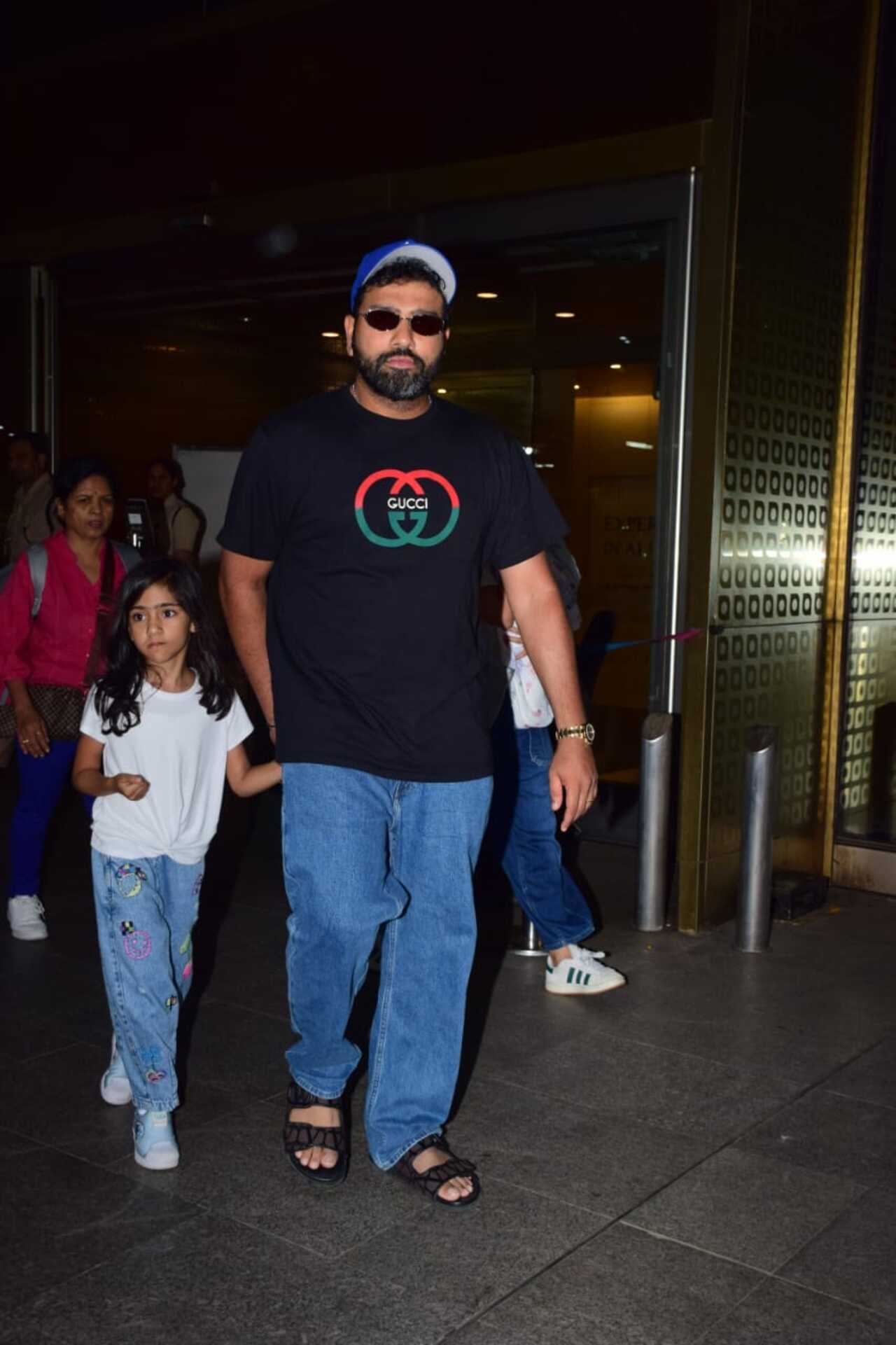 Cricketer Rohit Sharma papped at the airport with his daughter