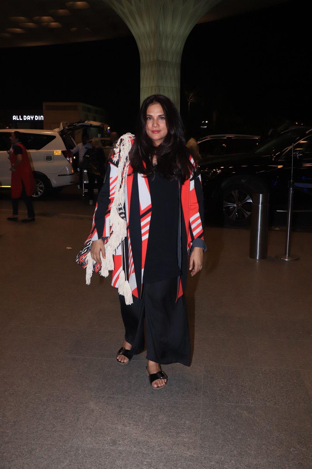 Richa Chadha looked stylish in a black gown paired with a stylish jacket as she was clicked at Mumbai airport.
