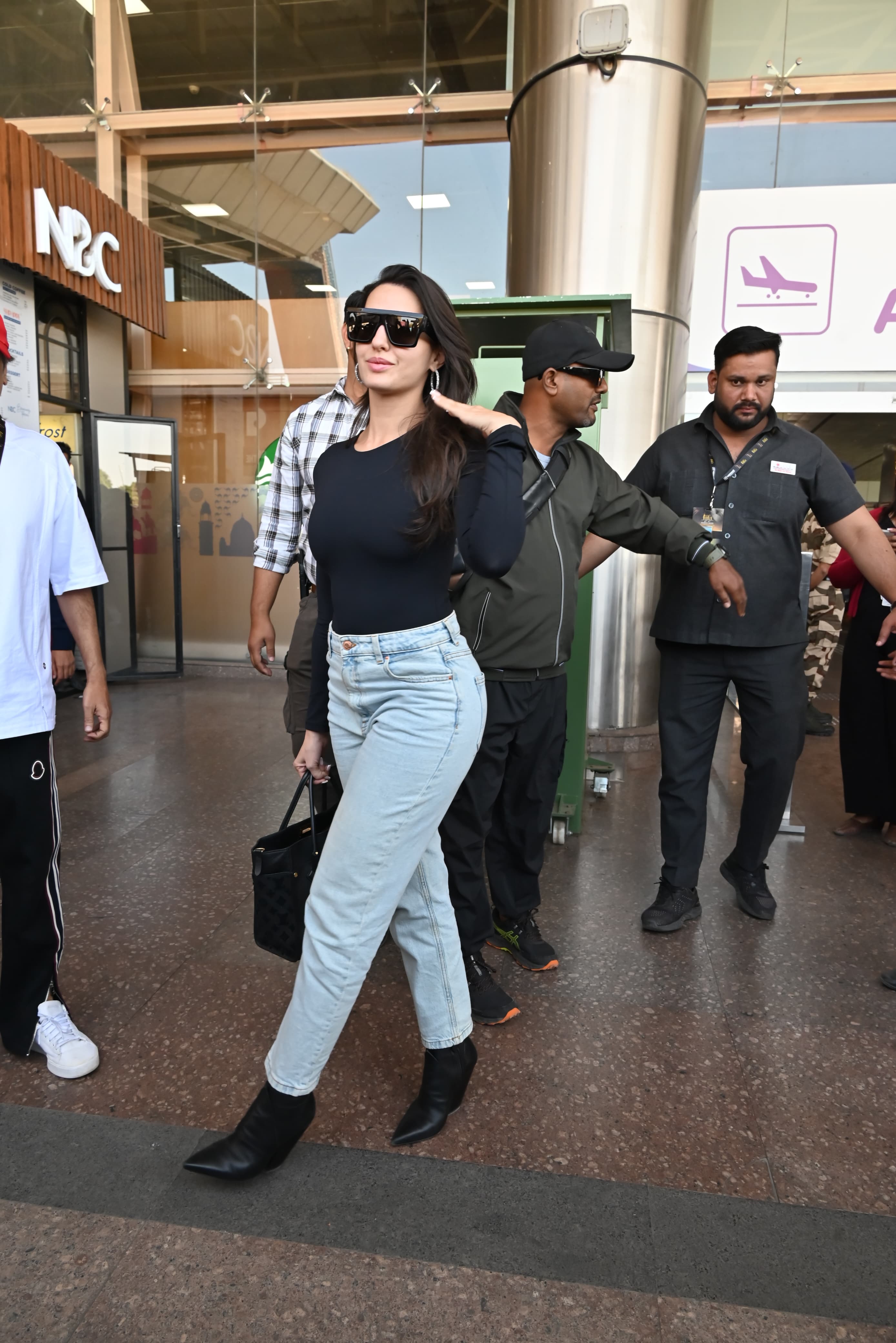 Nora Fatehi looked stylish in a black top and light blue jeans. The actress' airport look at Jaipur was surely an inspiration.