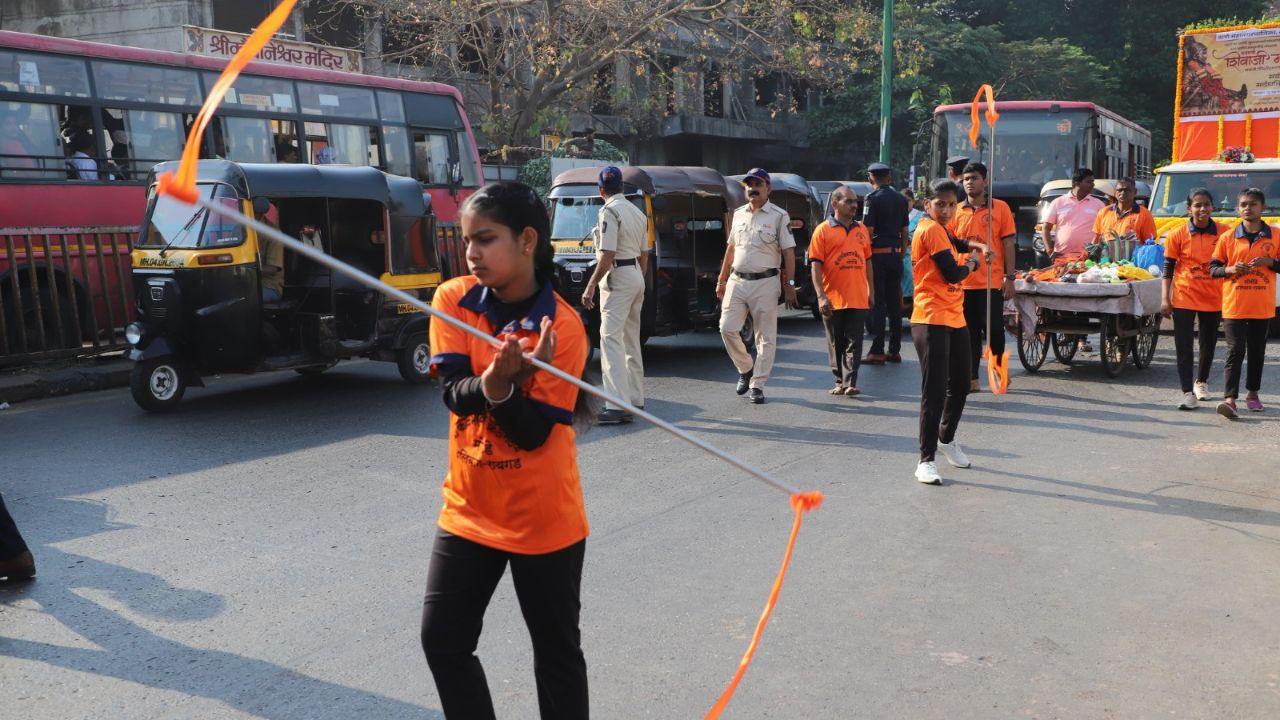 A girl performing an art form during the procession