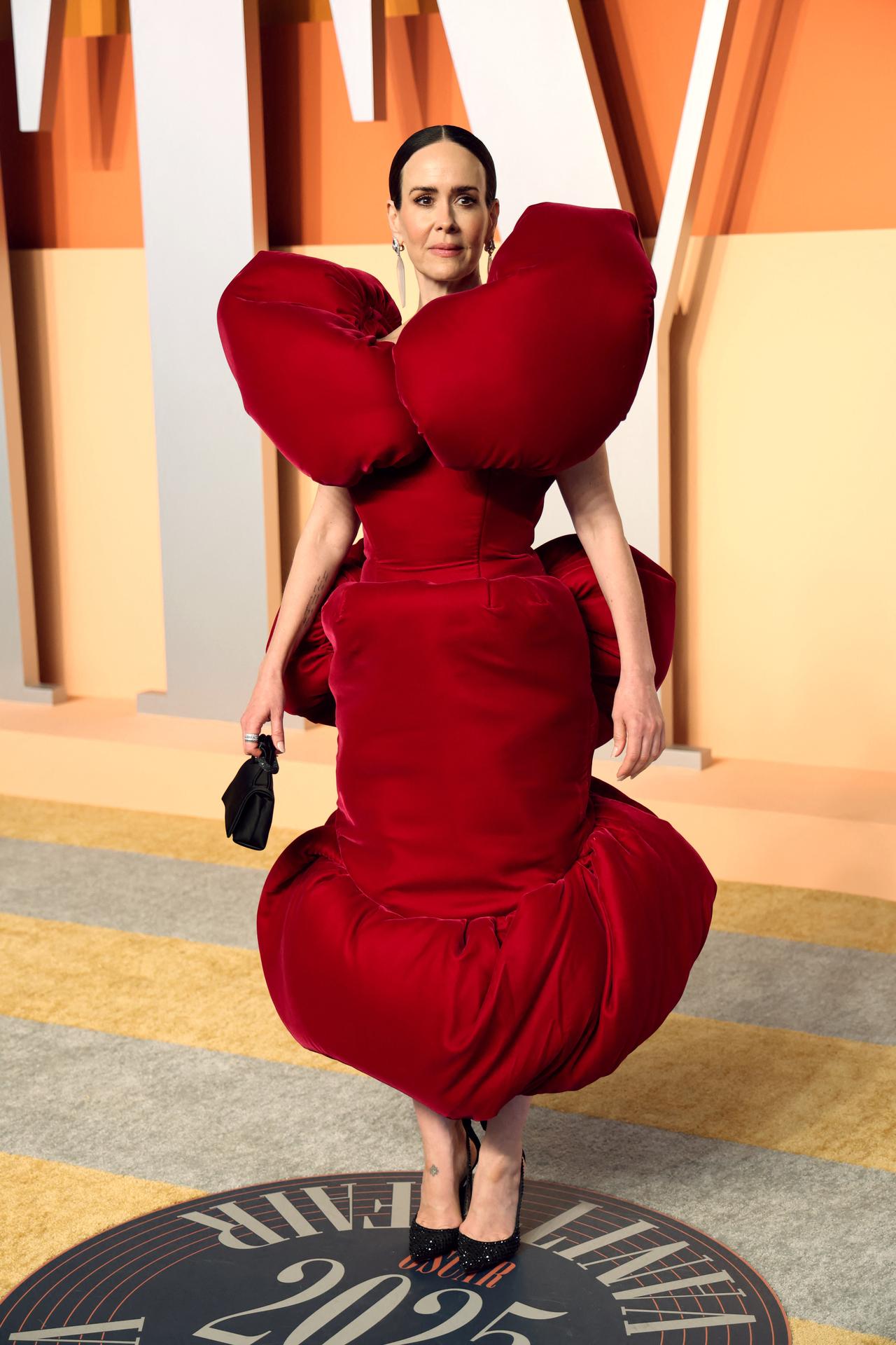 Sarah Paulson raised brows in her vibrant red fashionable outfit.