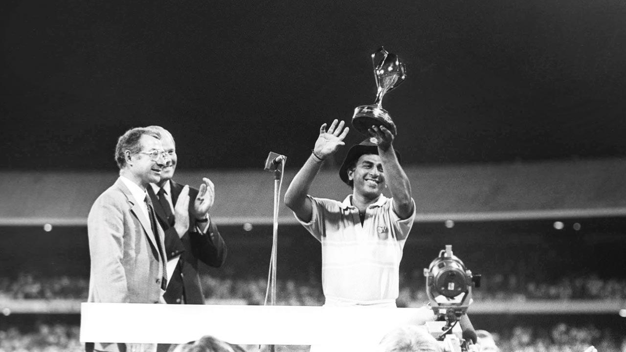 India captain Sunil Gavaskar holds aloft the 1985 B&H World Championship of Cricket trophy after beating Pakistan at MCG