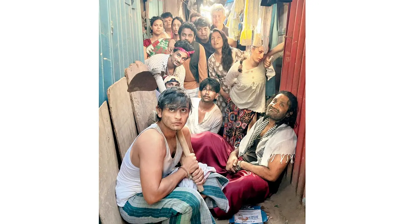 The cast visits the slums in Versova