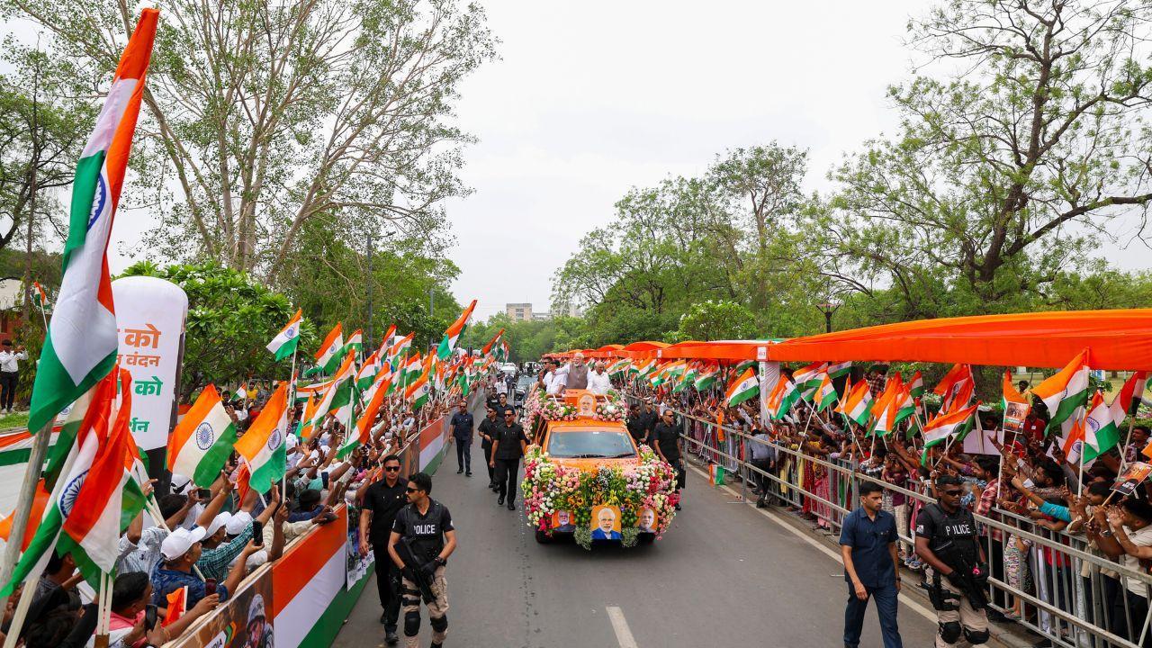  Prime Minister Narendra Modi on Tuesday held a mega roadshow in Gandhinagar on the second day of his visit to Gujarat. (Pics/PTI)