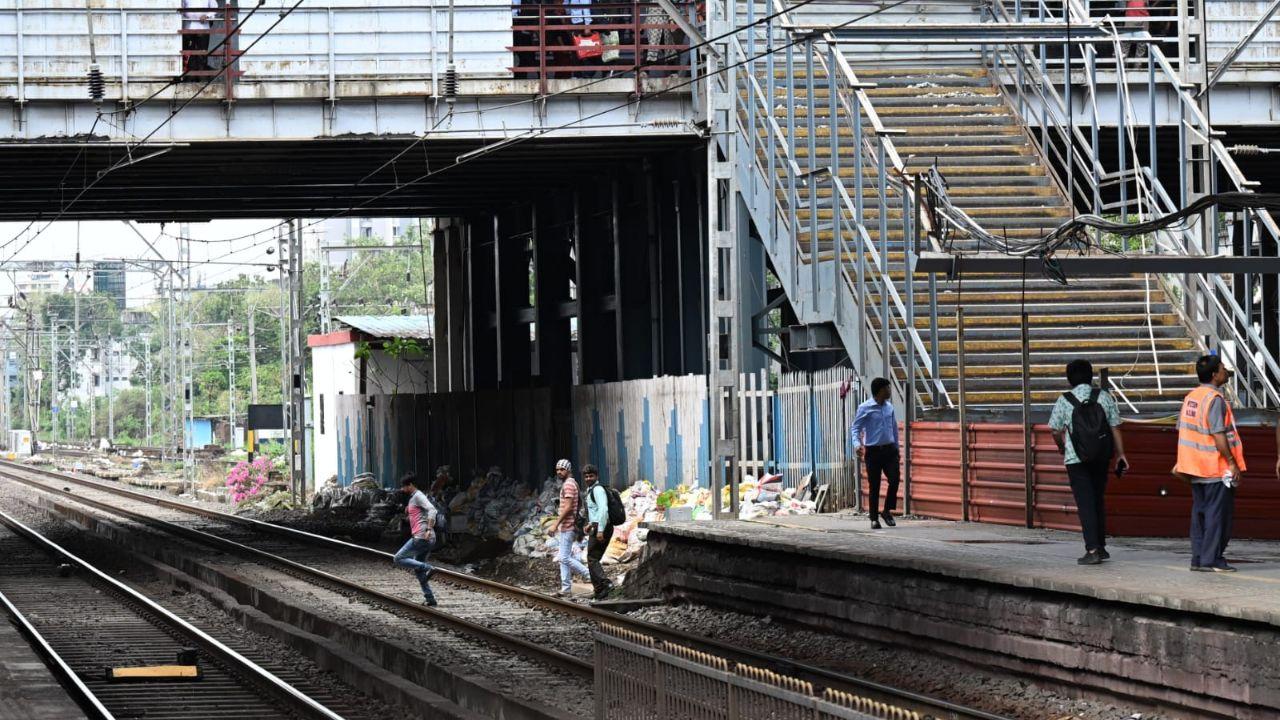 People at the station were seen crossing the railway line because of the heavy congestion on the newly built foot-over bridge