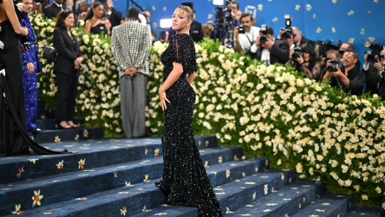 Sydney Sweeney
Sydney Sweeney looked beautiful in a black sparkling gown by Miu Miu, but her glam look failed to do justice to the theme of the event, and the theatrical style of the Met Gala