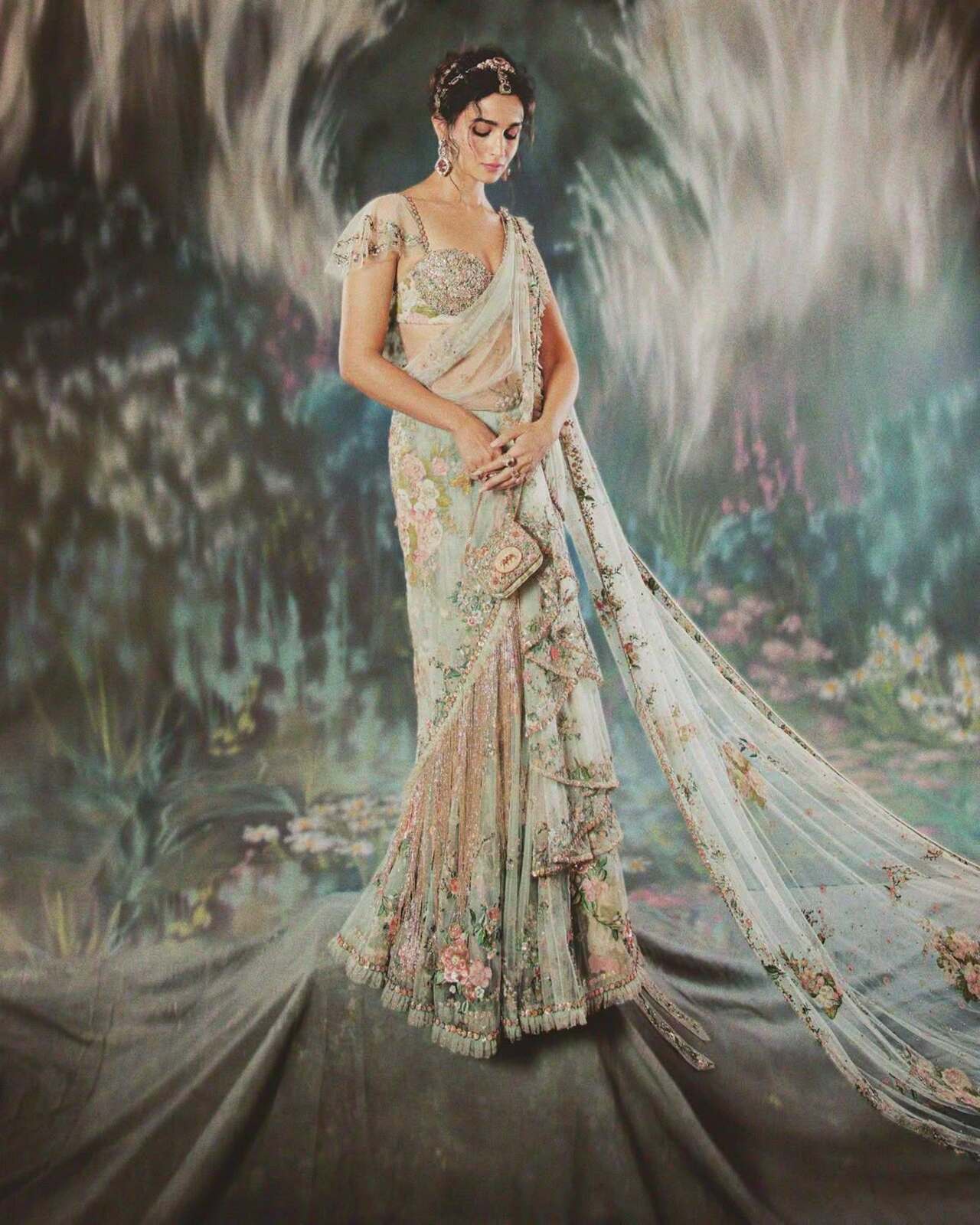 For her second and most talked-about Met Gala appearance in 2024, Alia embraced the theme The Garden of Time in a custom Sabyasachi outfit. The look featured a radiant, floral saree-inspired ensemble with a dramatic 20-foot-long pallu