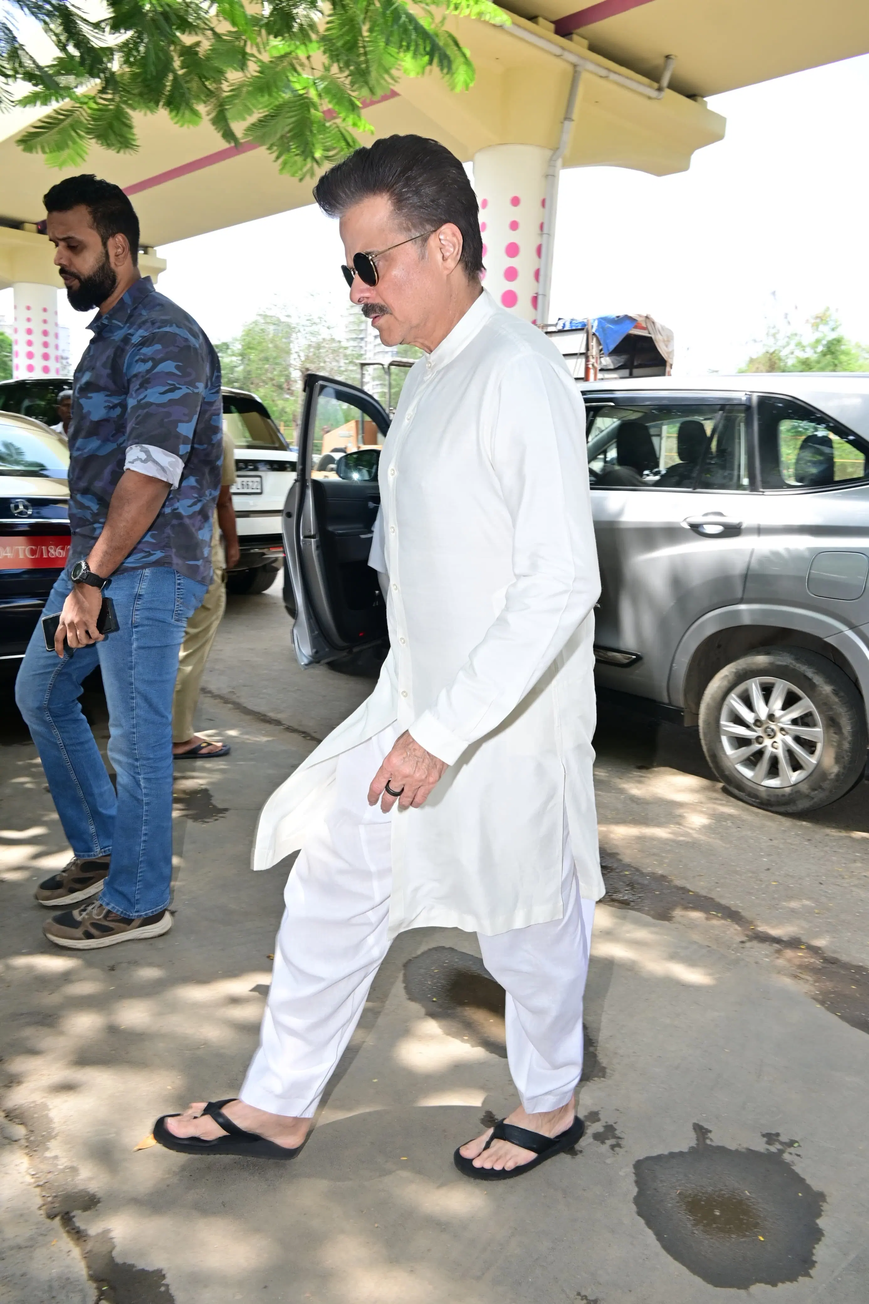 A visibly disturbed Anil, dressed in a white kurta-pajama, was seen ignoring the paparazzi as he hid his sadness behind dark black sunglasses