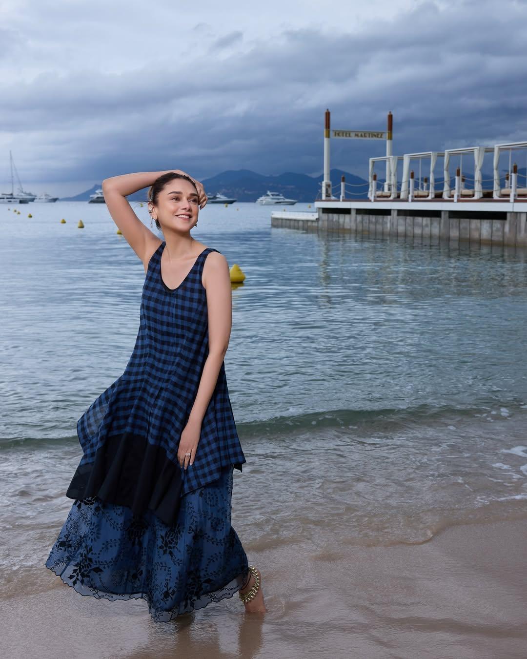 On Instagram, she posted several pictures standing barefoot on the beach, with the sea and a pier in the background. The grey skies hinted at stormy weather, but Aditi looked radiant and serene