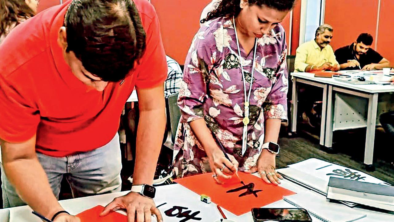 Students at a Chinese calligraphy session. pic courtesy/INDIA CHINA ACADEMY on INSTAGRAM