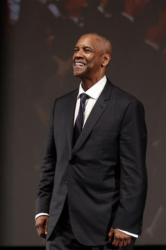 Denzel Washington looked sharp as he smiled for the camera, dressed in a classic black suit paired with a white shirt and a bow tie. Washington was present for the screening of Highest 2 Lowest