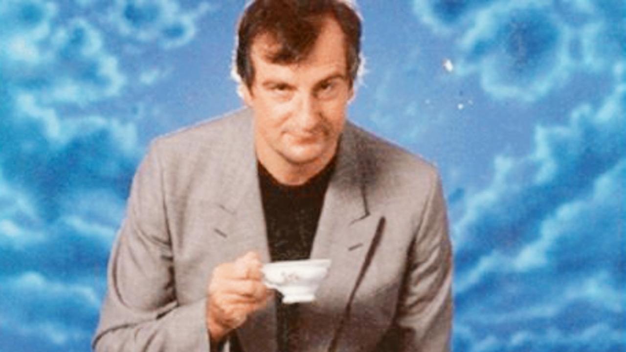 Douglas Adams (Photo Courtesy: Open Culture)
The Hitchhiker’s Guide to the Galaxy
Douglas Adams sneaks in his fascination for tea through an episode in the iconic book. Arthur Dent yearns for a cup of tea on the spaceship to take a moment of respite. Instead, he gets a liquid from the Nutri-Matic drink dispenser, which is nothing like tea