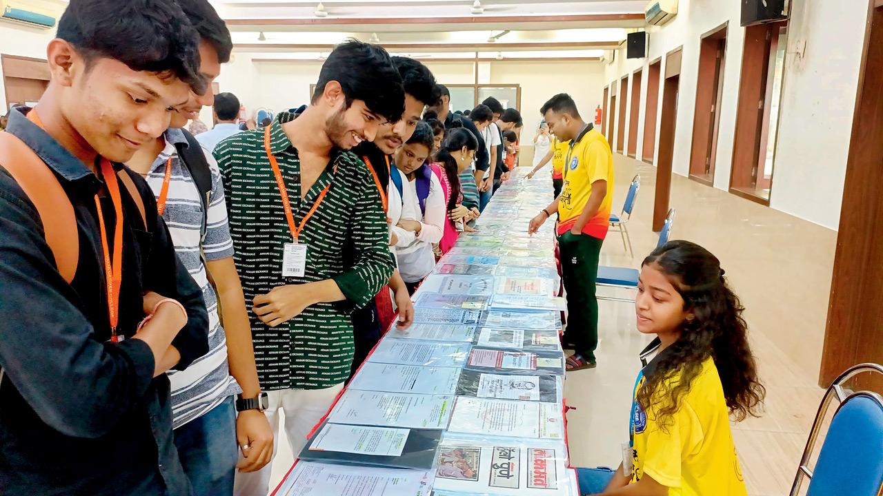 Visitors view Joshi’s collection at a previous exhibition