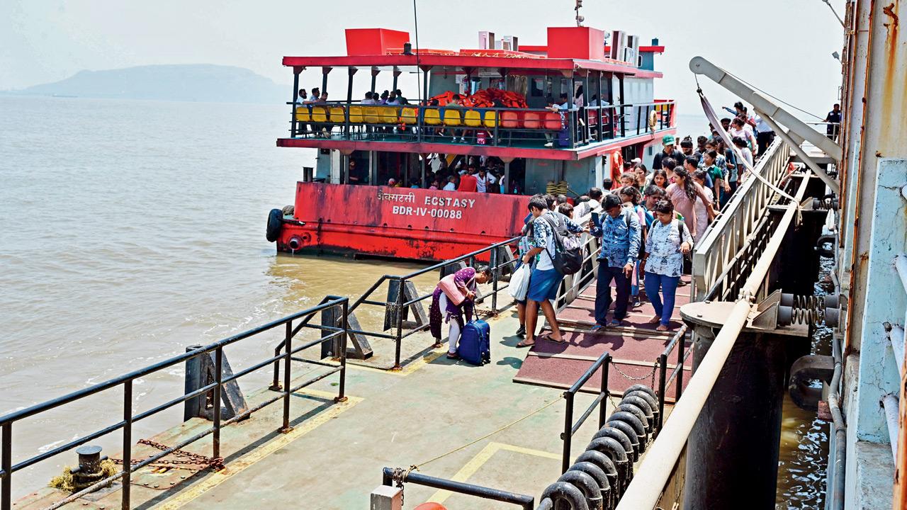 Mumbaikars alighting from a ferry on Monday afternoon