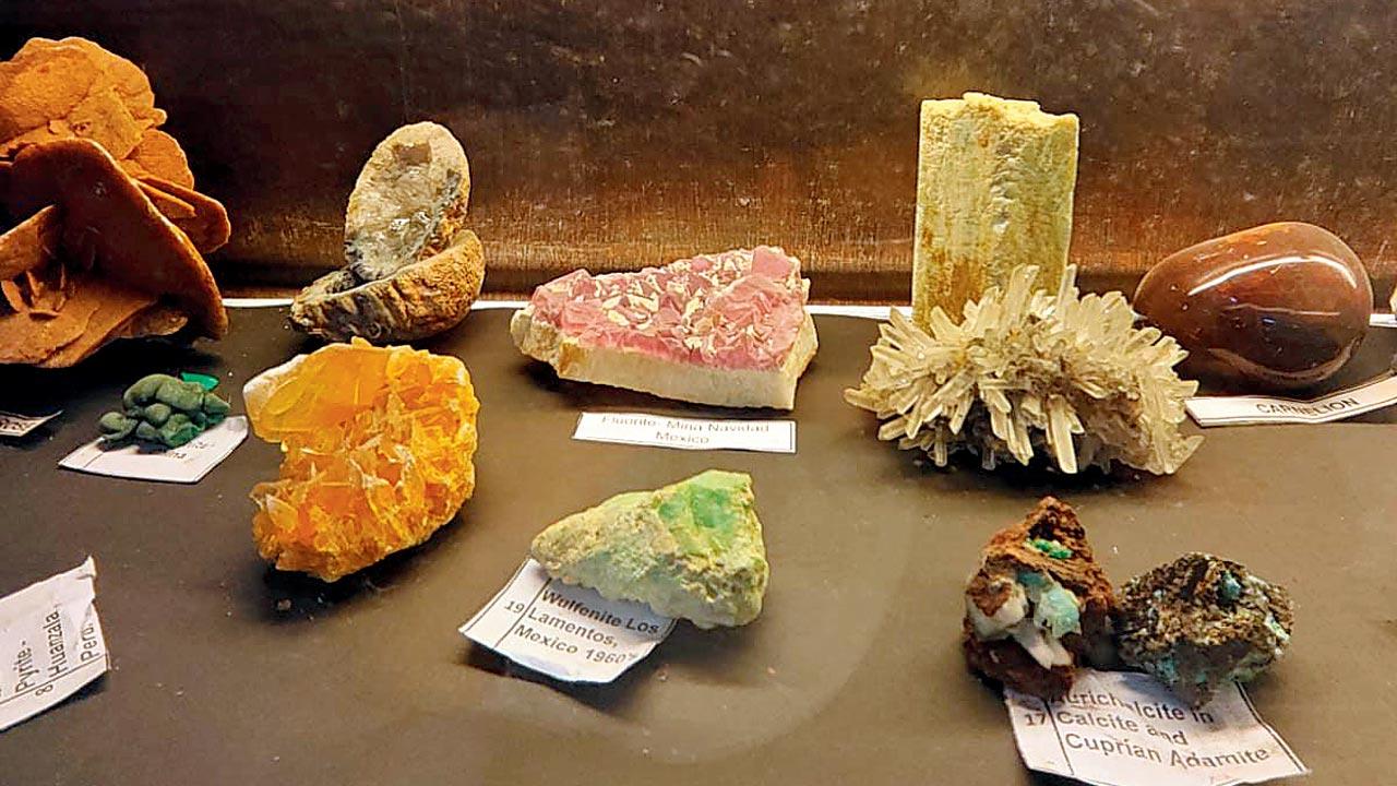 A collection of minerals, including (centre) a wulfenite specimen 