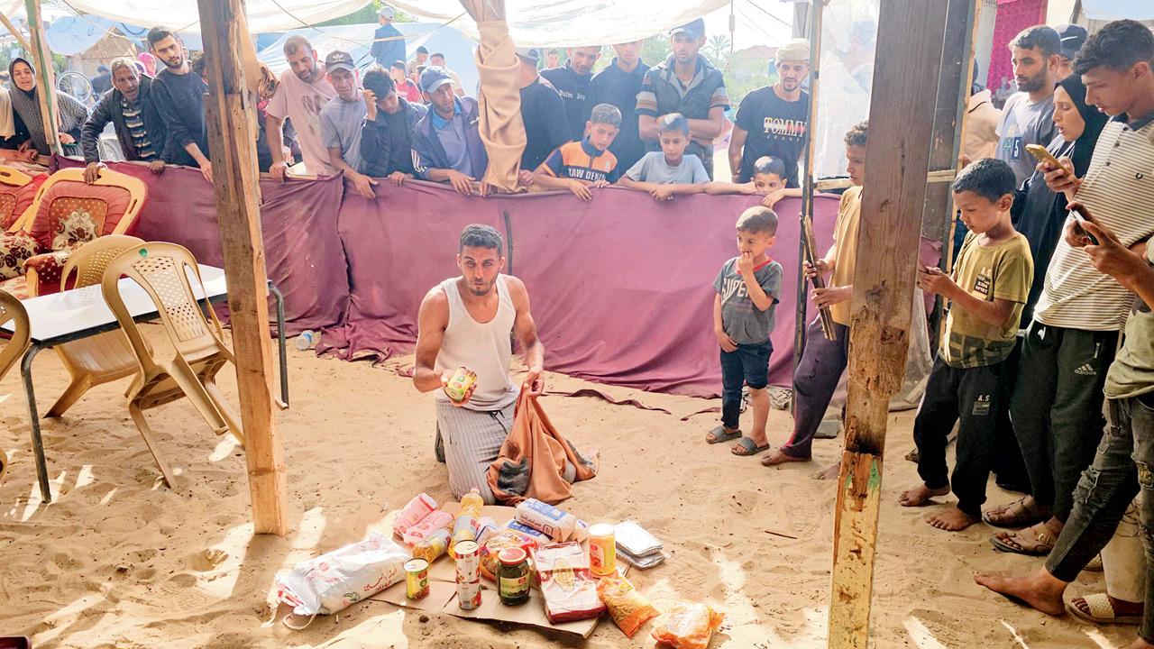 One killed, 48 wounded after forces fire on crowd at aid site in Gaza