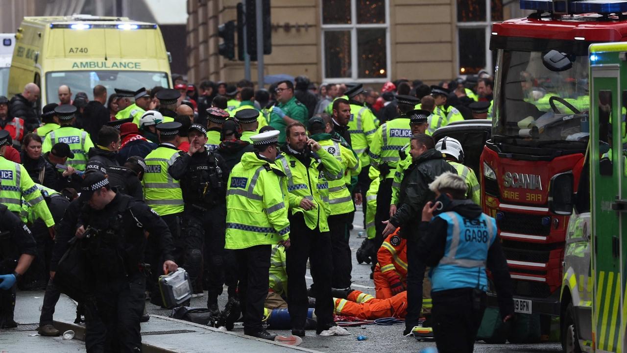 Detectives were working to piece together how a minivan plowed into crowds packing a narrow street, just after the players of Liverpool Football Club had celebrated the Premier League championship with an open-topped bus parade