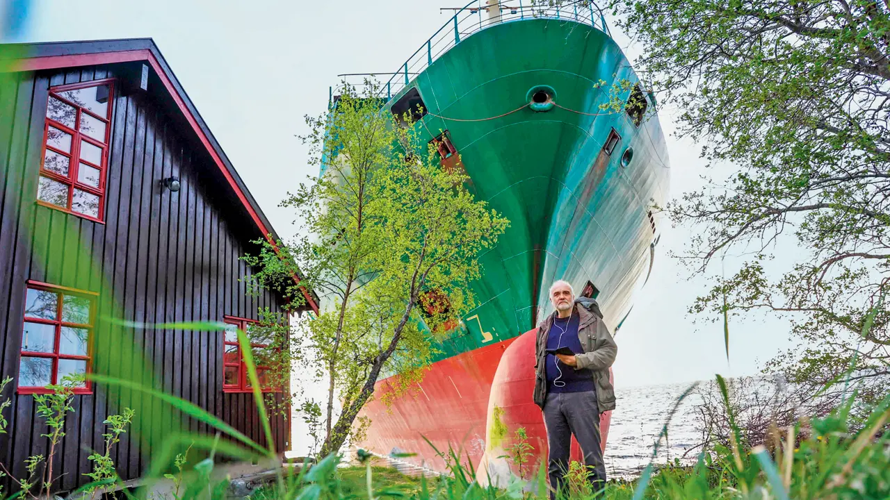 Norwegian man awakes to find ship grounded beside home