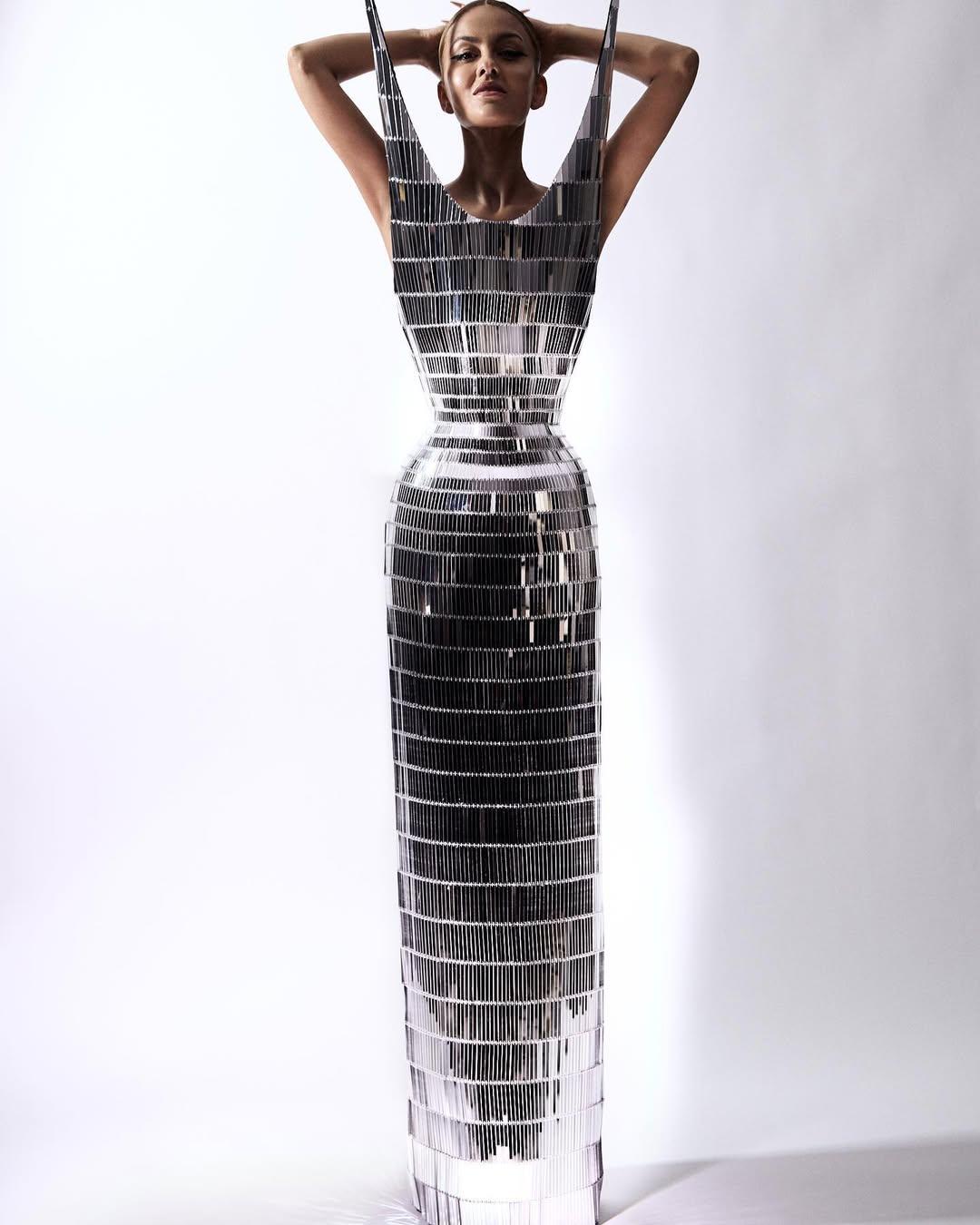 In 2023, Natasha Poonawala returned to bring drama with Schiaparelli, as she wore an all-silver dramatic gown with sharp edges framing her face. The futuristic look was paired with a sleek hairdo and a beautiful piece of jewellery that gave the look a new edge