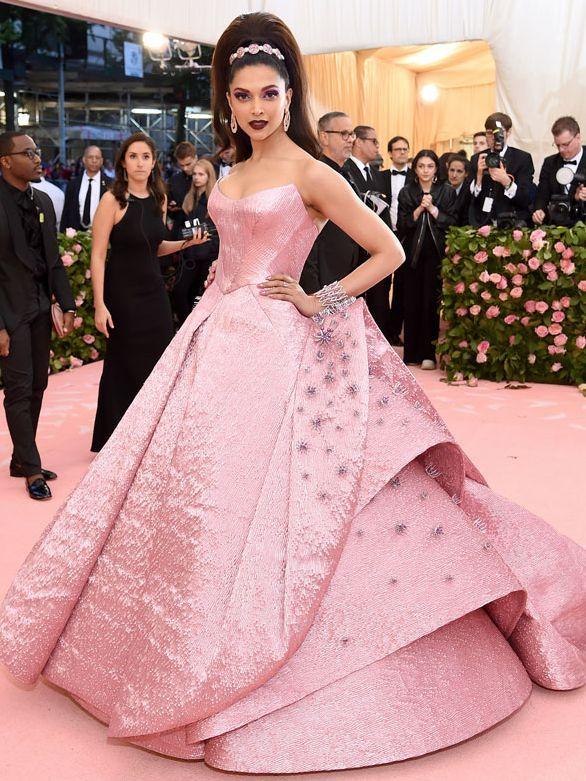 In her third and final appearance (as of yet) in 2019, Deepika Padukone gave her best Met Gala look yet. The theme was Celebrating Camp: Notes on Fashion, and she brought the much-needed pink drama to the carpet. She chose a Zac Posen outfit for the day, a pink single-piece structured ball gown with dramatic details and an equally campy train. The 400 pieces of three-dimensional embroidery on the strapless gown were made from Lurex jacquard. She went for a high ponytail and bold maroon lips with vibrant eye makeup, completing the look