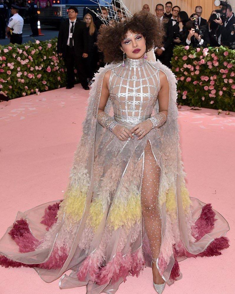 Celebrating Camp: Notes on Fashion was one of the most talked-about Met Gala themes of all time. The year 2019 was marked with camp, and Priyanka Chopra Jonas again made sure she was the talk of the town as she went to the extreme end of being campy and how. For her third outing, she chose a dramatic Christian Dior dress with a messy hairdo, a dramatic crown, and a face of messy makeup, all coming together to define the very quirky theme