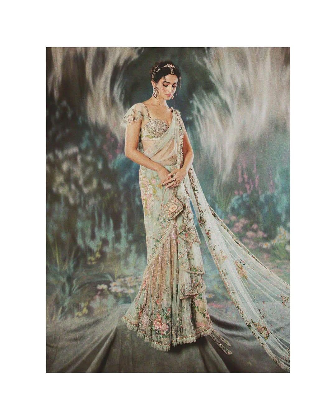 Alia Bhatt made her second and most headline-grabbing appearance in 2024, when the theme was The Garden Of Time. Alia walked the carpet in a custom-made Sabyasachi outfit with an over 20-foot long pallu. The floral details on the dress draped like a saree were radiant and beautiful. As for the accessories, she went all dramatic in the Sabyasachi vibe. A curly hairdo and a very detailed face of makeup elevated the look