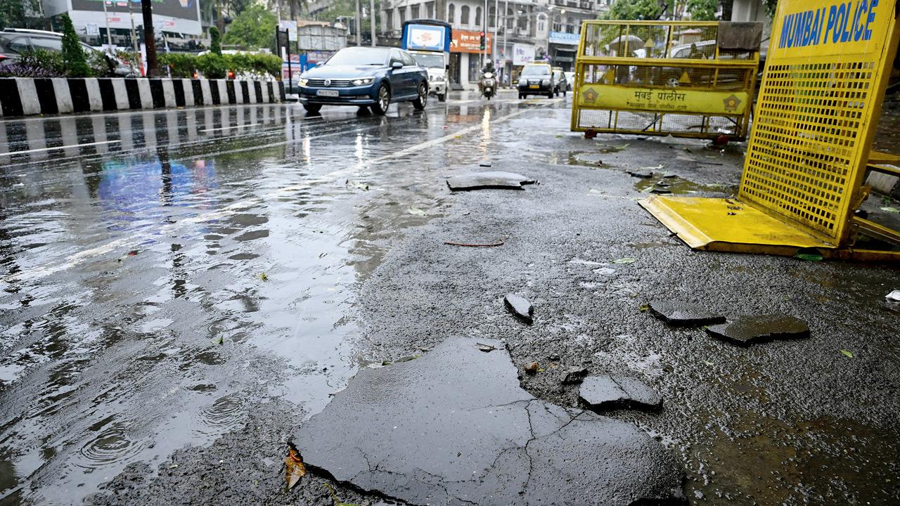 A tarred road peels right off following heavy rain overnight