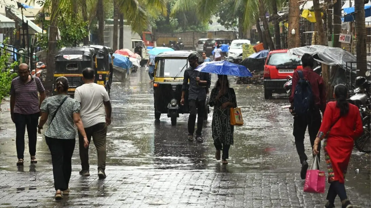 In Photos: Rain lashes several parts of city, brings relief from humidity