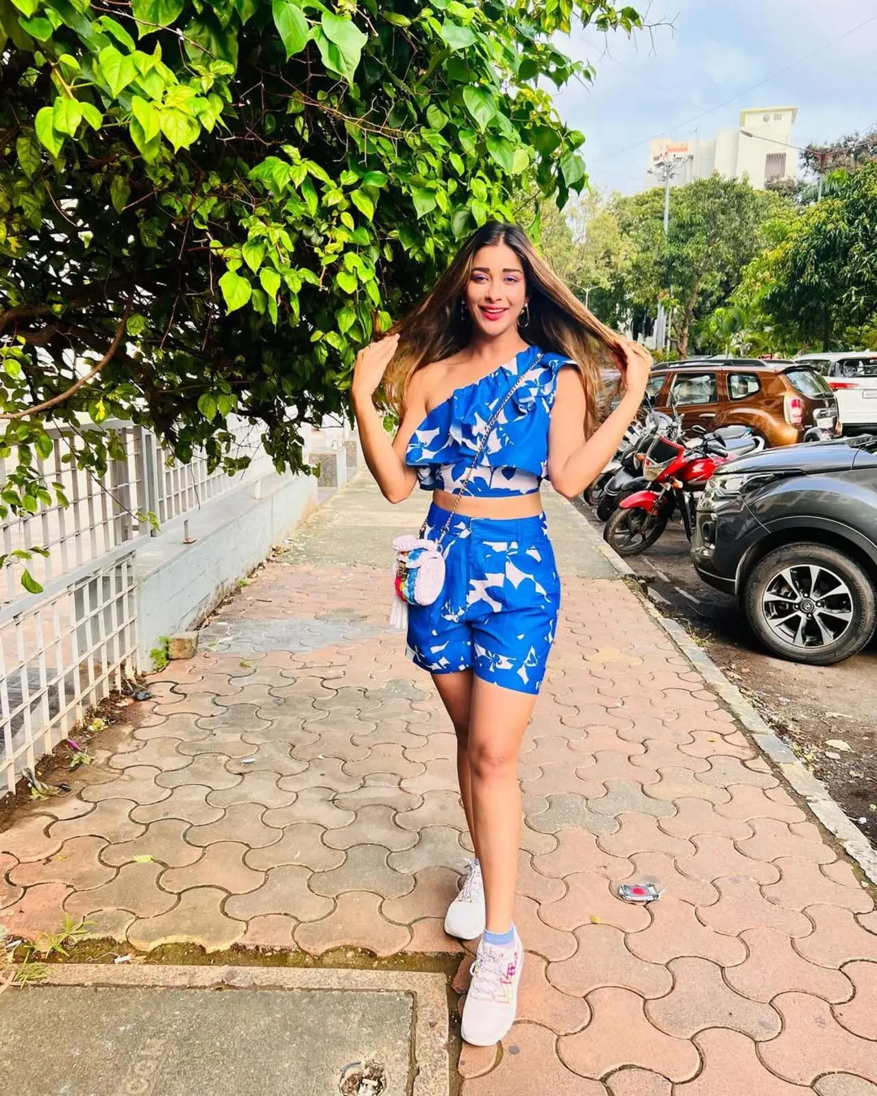 If you’re a college girly, then Nyrraa's look can be your best friend this summer season. In this look, the actress wore a stylish co-ord set, and its blue colour with white prints gives off cool and breezy vibes