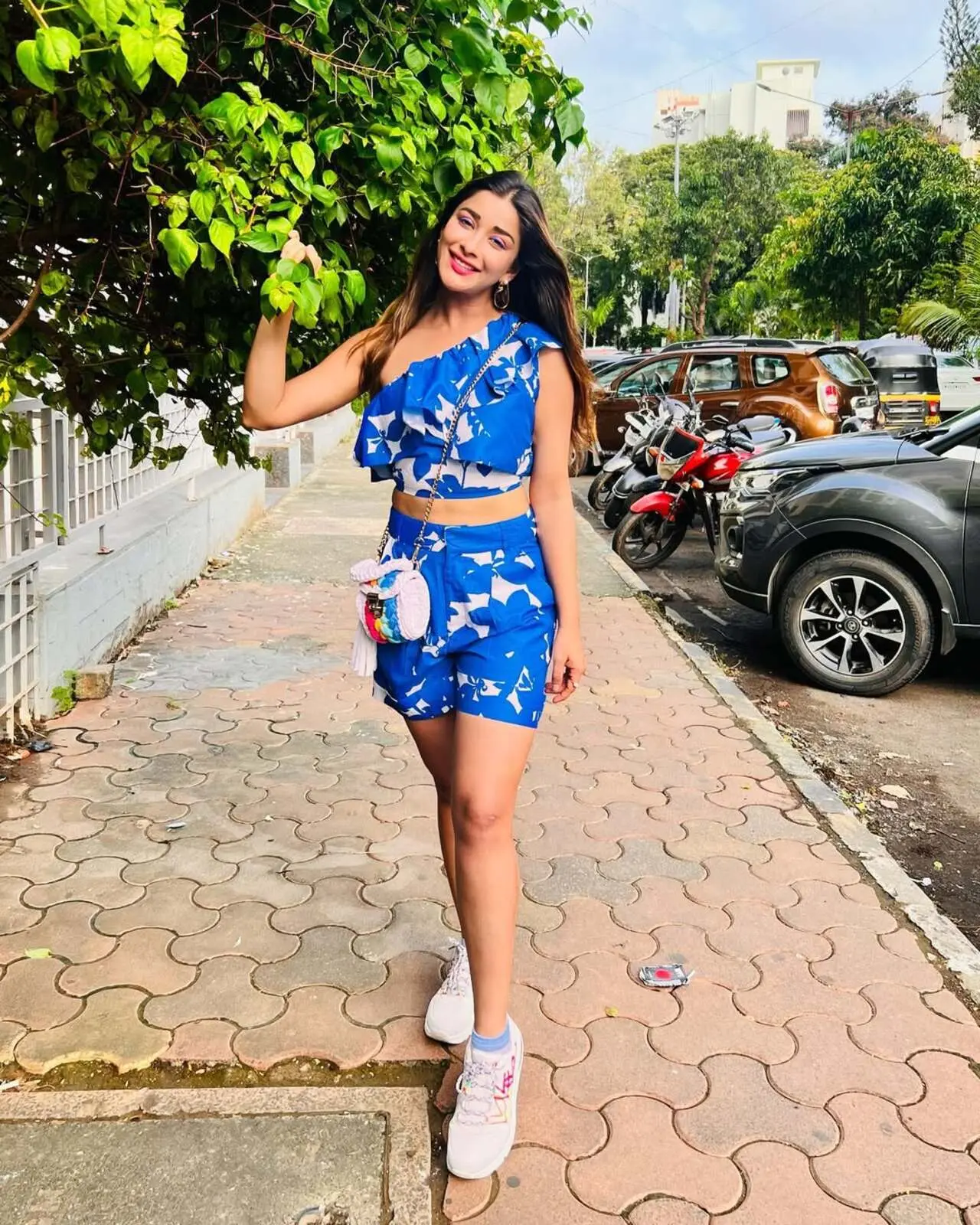 To enhance her appearance, Nyrraa gave this outfit a sporty twist. With her crop top and shorts, she wore stylish white sneakers — and honestly, we believe it's a perfect hit. Nyraa further left her hair open, which elevated her look