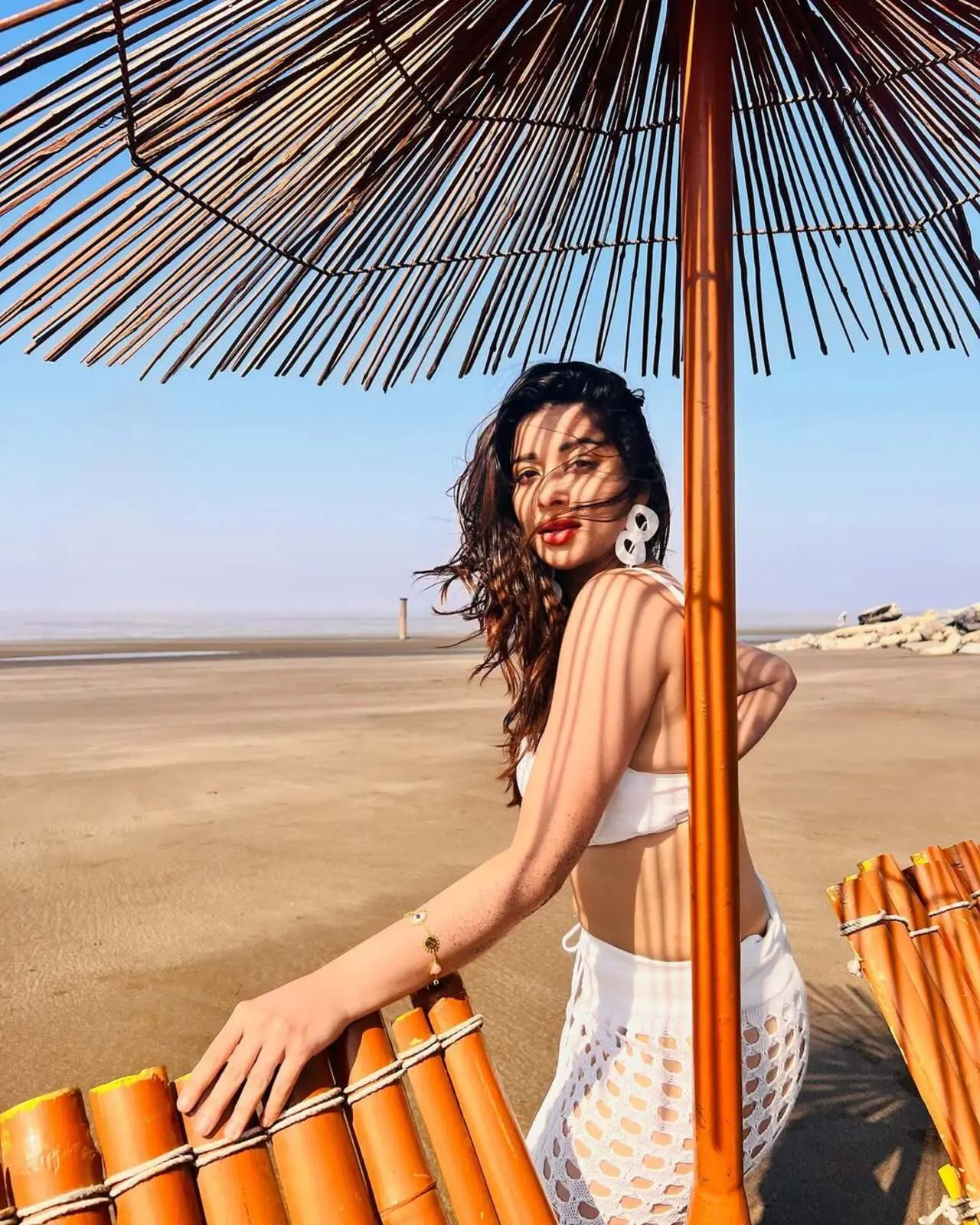 For this look, Nyrraa styled a stunning bralette with a see-through skirt — and she honestly ate! The actress accessorised her look with stylish matching long earrings and left her hair open
