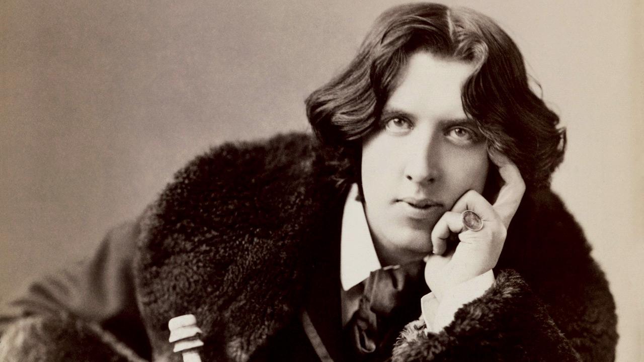 Oscar Wilde
The Importance of Being Earnest
Oscar Wilde is a master of writing scenes that navigate precarious situations over tea. During a tea service in the play, one of the characters, Cecily, makes a bad cup of tea for Gwendolen. She deliberately adds four lumps of sugar and cuts a big slice of cake despite Gwendolen’s refusal of the offer
Read full story: International Tea Day: How this brew was made popular in literature
