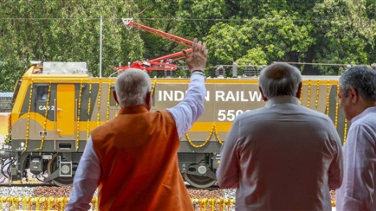  Prime Minister Narendra Modi flags off the country's first 9,000 horsepower locomotive engine, in Dahod, Gujarat. Pic/PTI