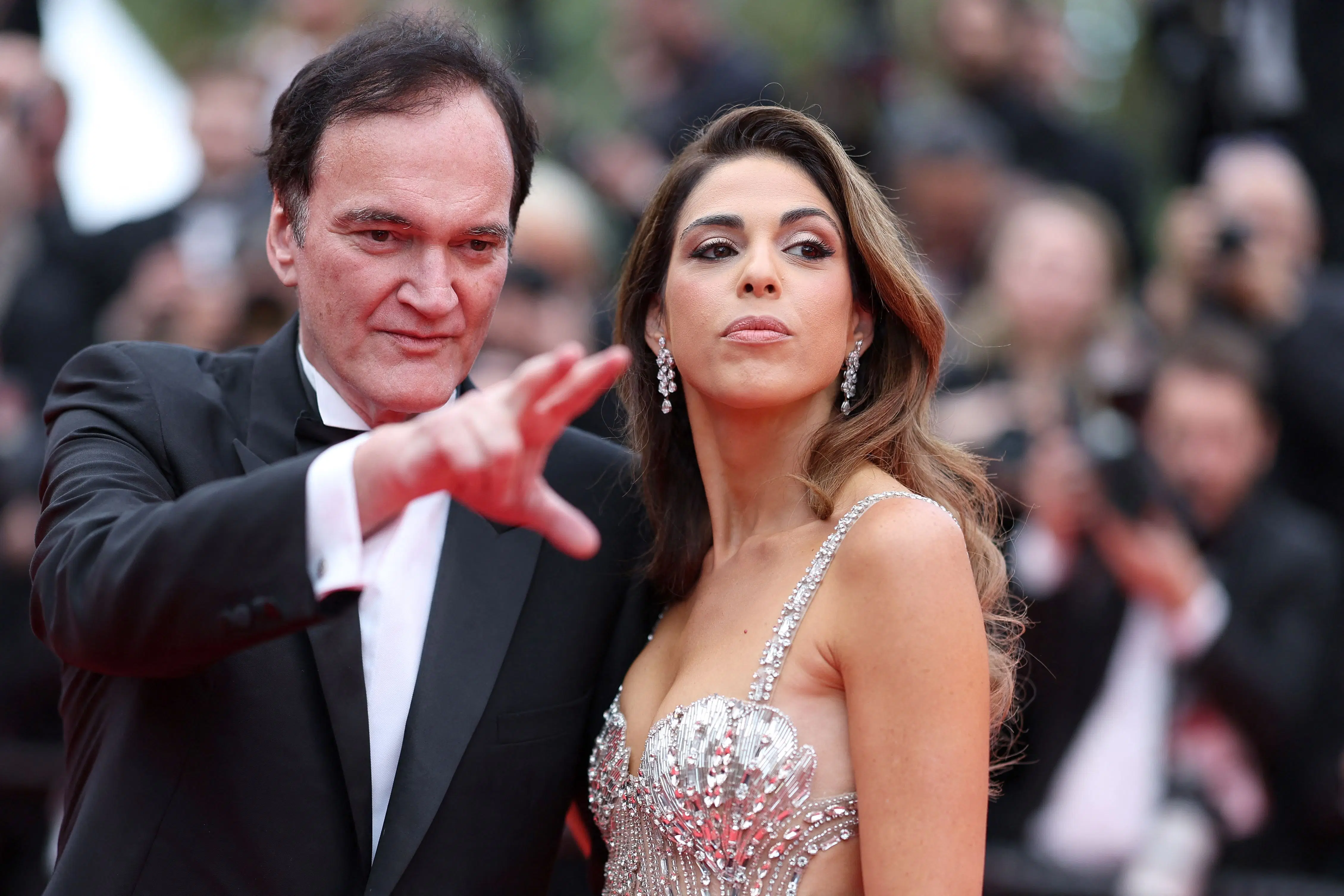 US film director Quentin Tarantino attended the opening ceremony with his wife, Israeli singer Daniella Pick. While Tarantino’s classic formal look turned heads, Daniella sparkled in a shiny sequin gown. The couple attended the Opening Ceremony and the screening of Partir un Jour (Bye Bye), presented out of competition