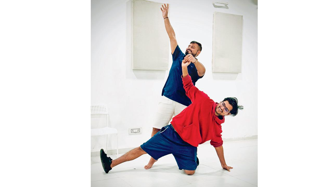 Artistes act out a slide show during an improv performance 