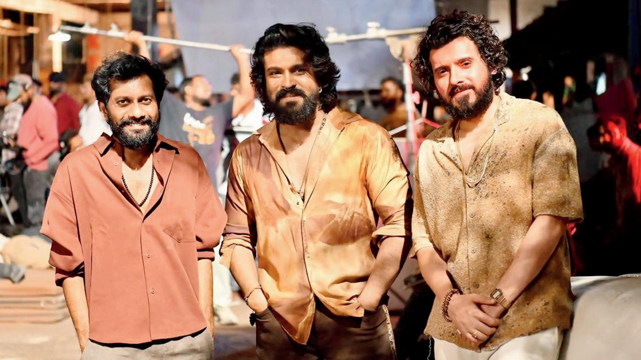 (From left) Buchi Babu Sana, Ram Charan, and Divyenndu