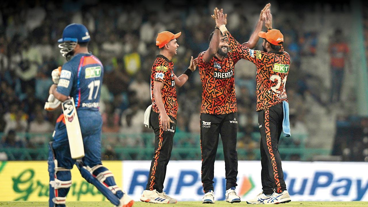 SRH players celebrate as LSG skipper Rishabh Pant walks backs after being dismissed for seven in Lucknow yesterday