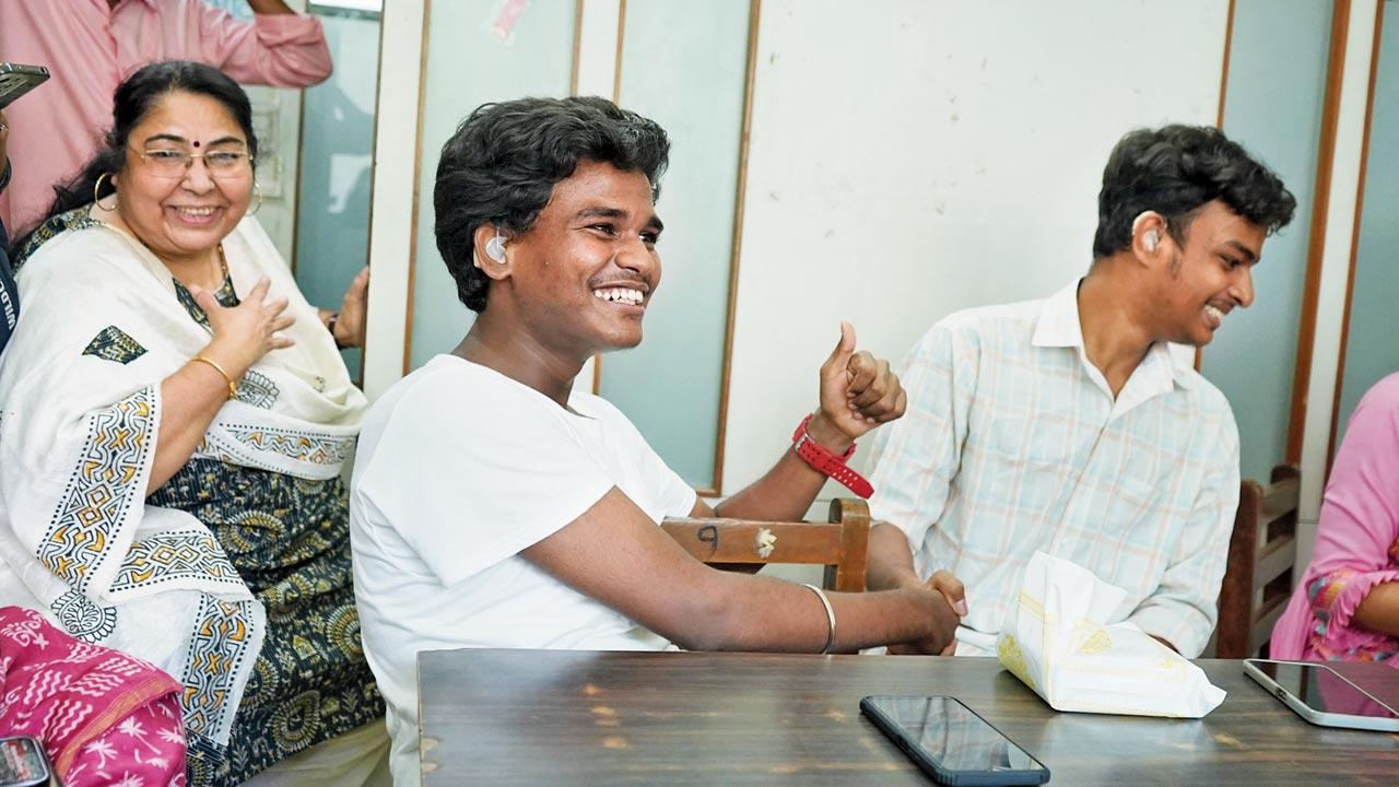 Students Anand Sable (in T-shirt) and Rohit Pawar celebrate after the SSC results are announced at the Utkarsha Mandal Mookdhwani School in Vile Parle East. Pic/Dweep Bane