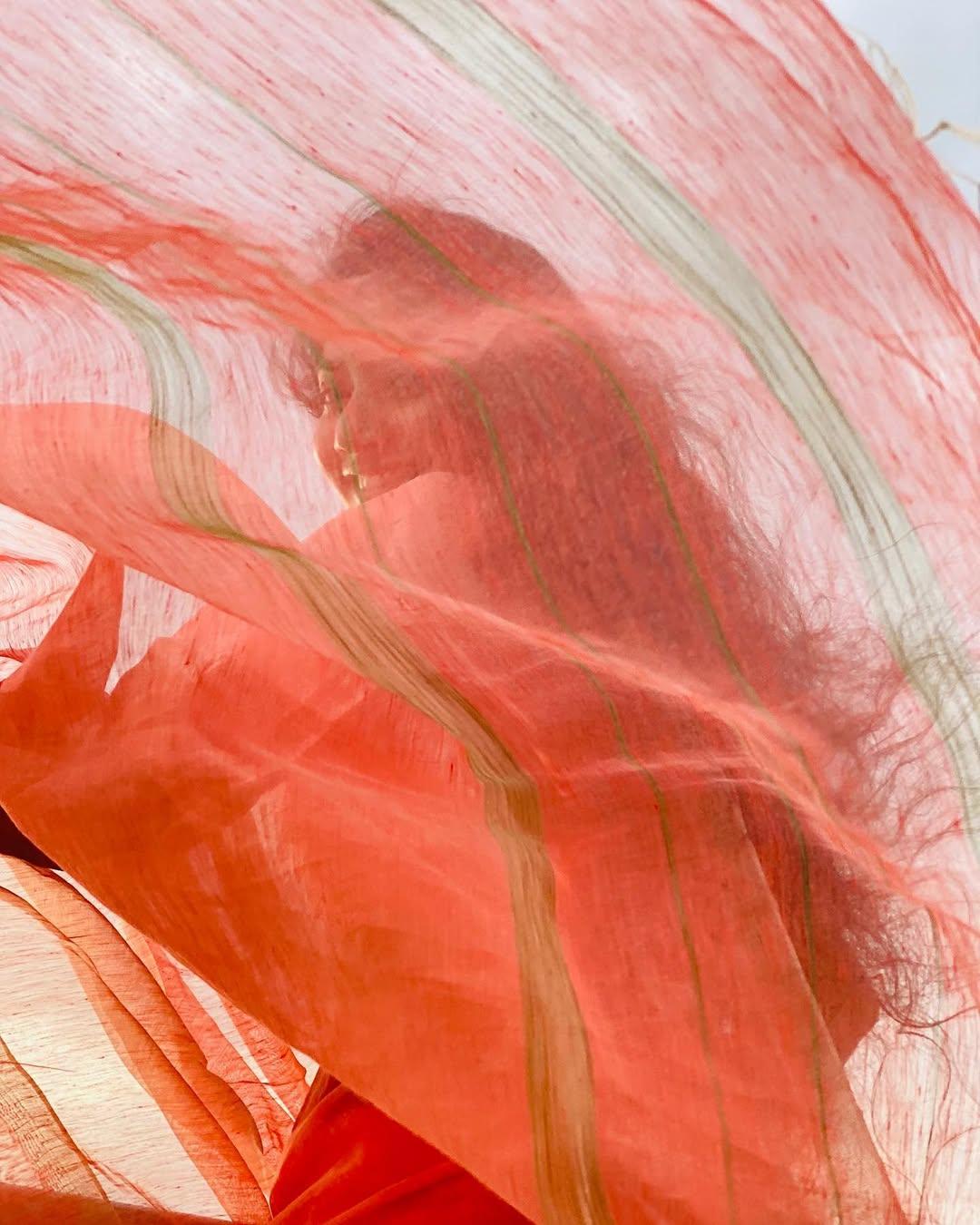 Such a cute little child she looks in this picture, as Sai enjoys windy weather in her simple orange kurta set paired with a sheer dupatta featuring a golden border