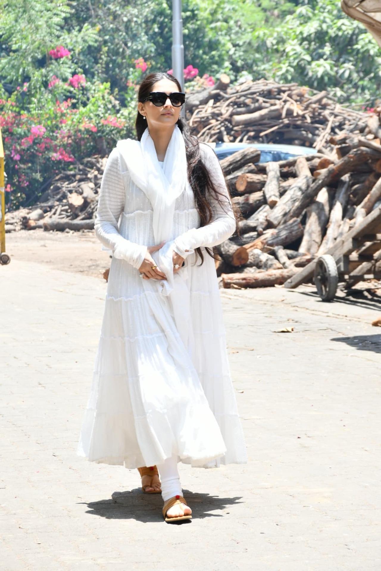 Sonam Kapoor looked visibly stressed as she hid her tears behind black sunglasses upon reaching the Vile Parle cremation ground to bid a final adieu to her grandmother