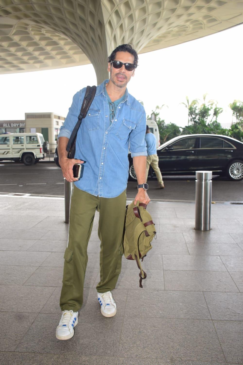 Dino Morea looked smart as he was snapped at the Mumbai airport. The actor looked stylish in green pants and paired them with a blue shirt, black sunglasses, and a stylish bag