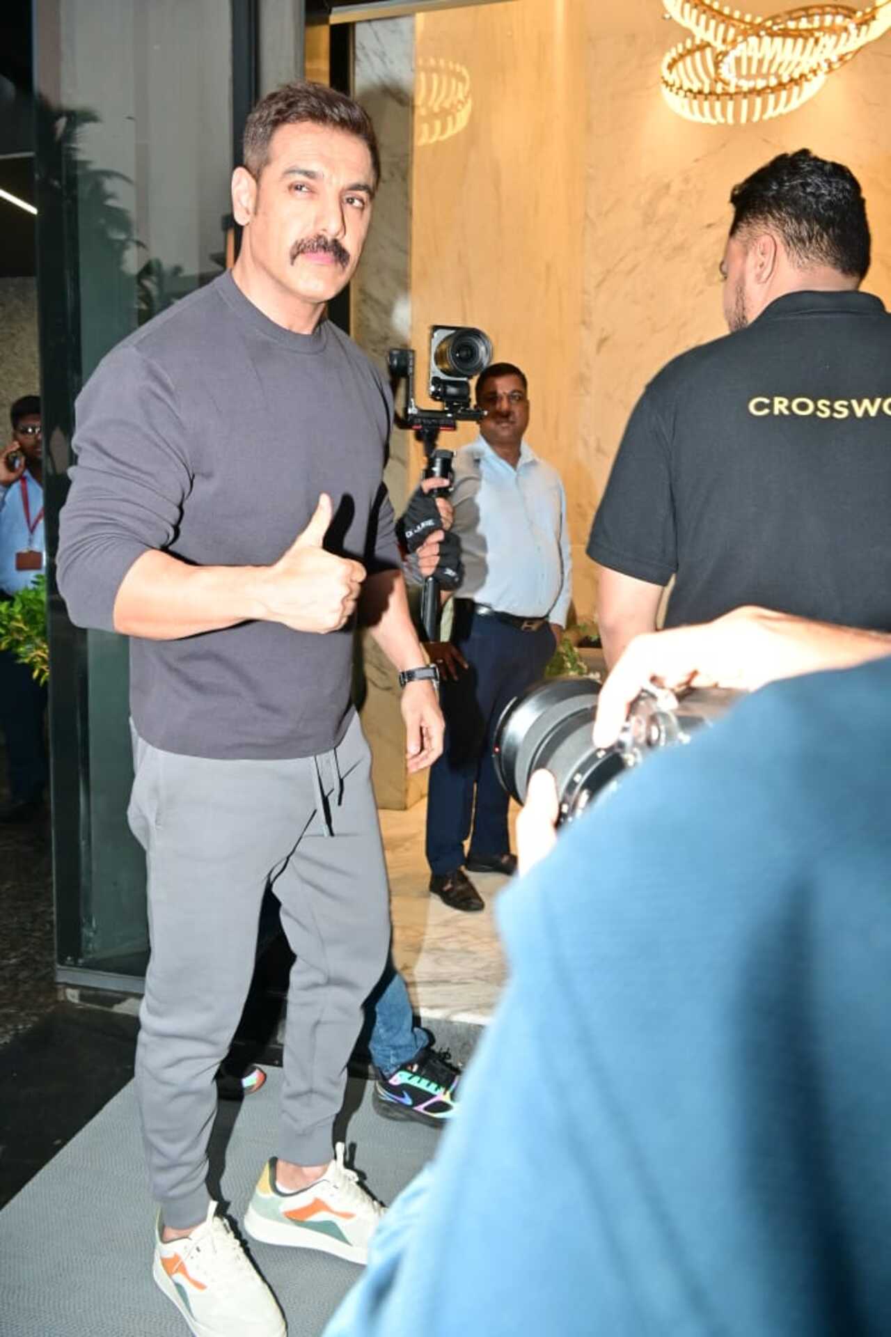 John Abraham looked smart as he attended an event in the city. The Diplomat actor was snapped wearing a smart full-sleeved T-shirt paired with grey pants