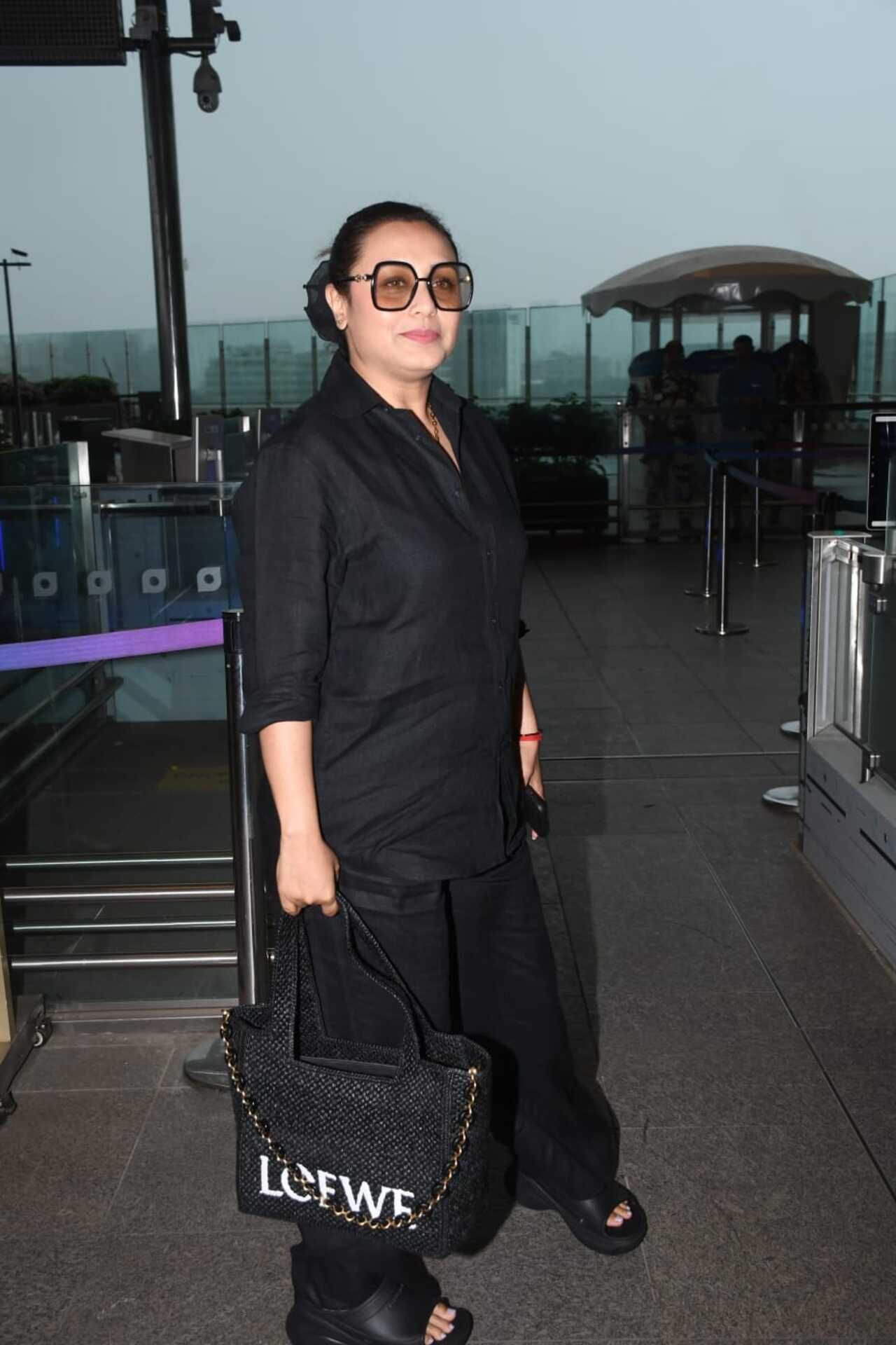 Rani Mukerji looked smart in her comfy airport look. The actress, who jetted off from the city, was snapped wearing a black co-ord set. With her hair tied back in a chic bun, she was seen wearing stylish glares