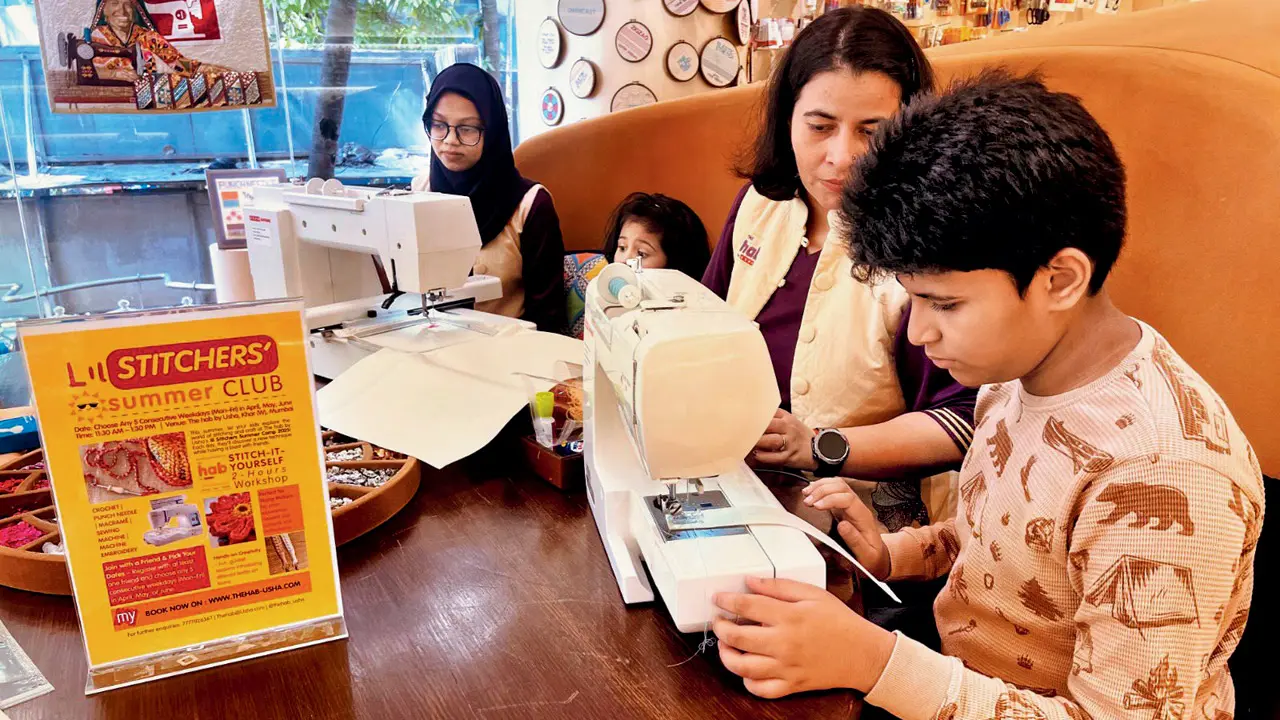 A child operates a sewing machine with the help of an expert at the workshop. Pic courtesy/The Hab by Usha