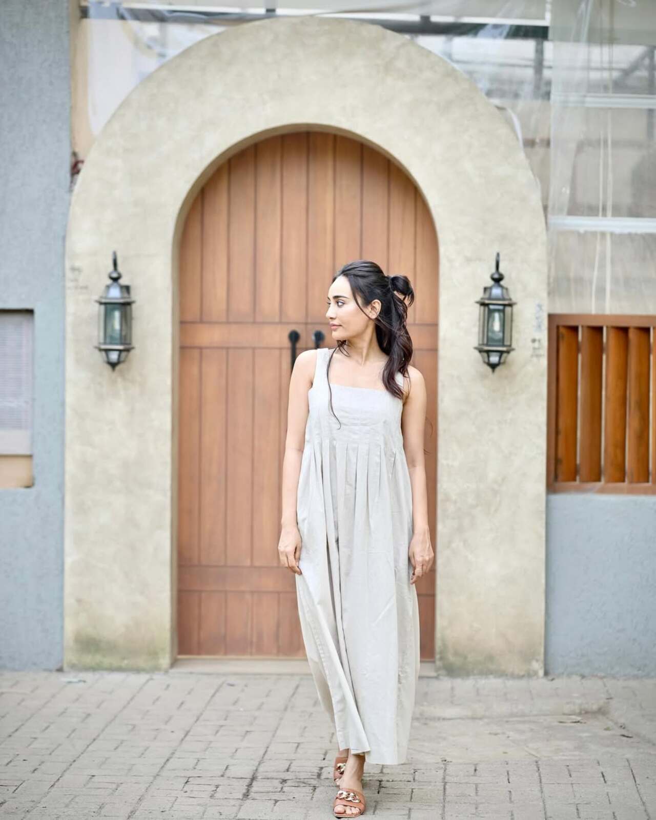 And then—slay alert! In yet another breezy look, Surbhi won hearts in a light brown strappy gown—this one deserves a permanent place in your everyday wardrobe