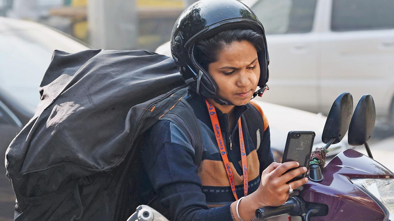 A delivery partner with an e-commerce logistics company with a massive haulage bag. The bags, when full, can weigh up to 40 kg