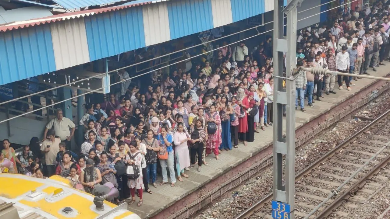 IN PHOTOS: Commuters at Borivali railway station brave heat as rain takes break