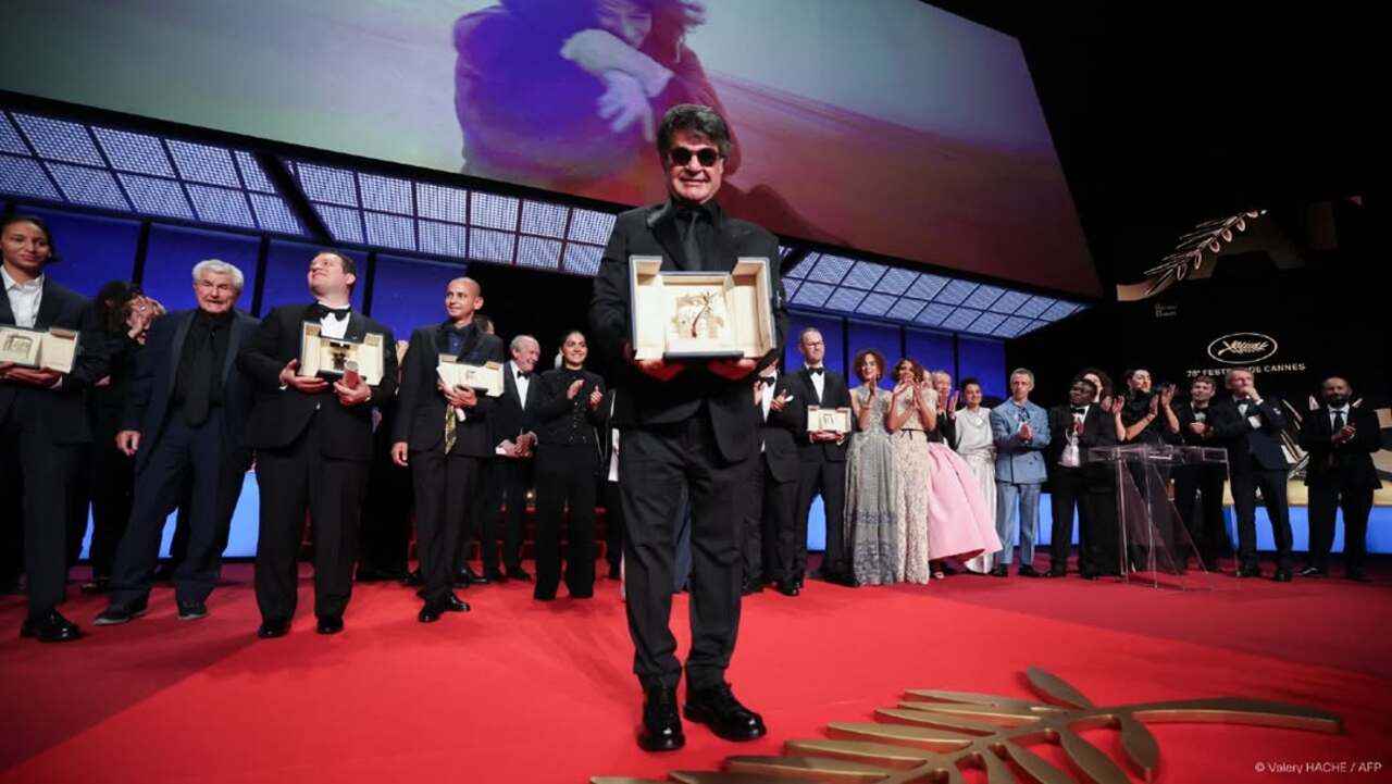 Iranian director Jafar Panahi accepted the Palme d'Or for 'It Was Just an Accident', a film directly inspired by his time in prison at the 78th Cannes Film Festival